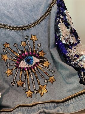 Evil Eye Sequin Bomber🦋
Light wash denim meets full blue,silver sequin jacket .